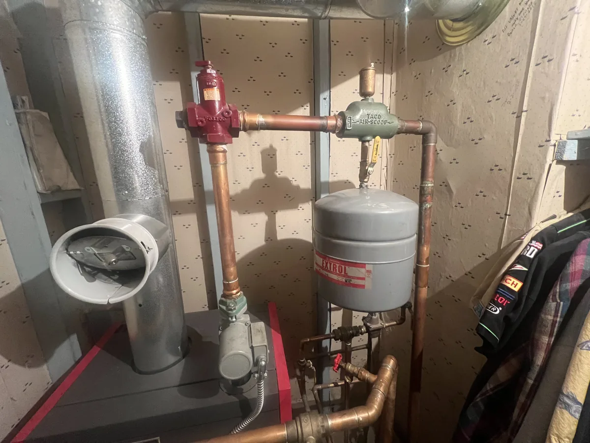 Residential gas boiler with its copper piping and expansion tank
